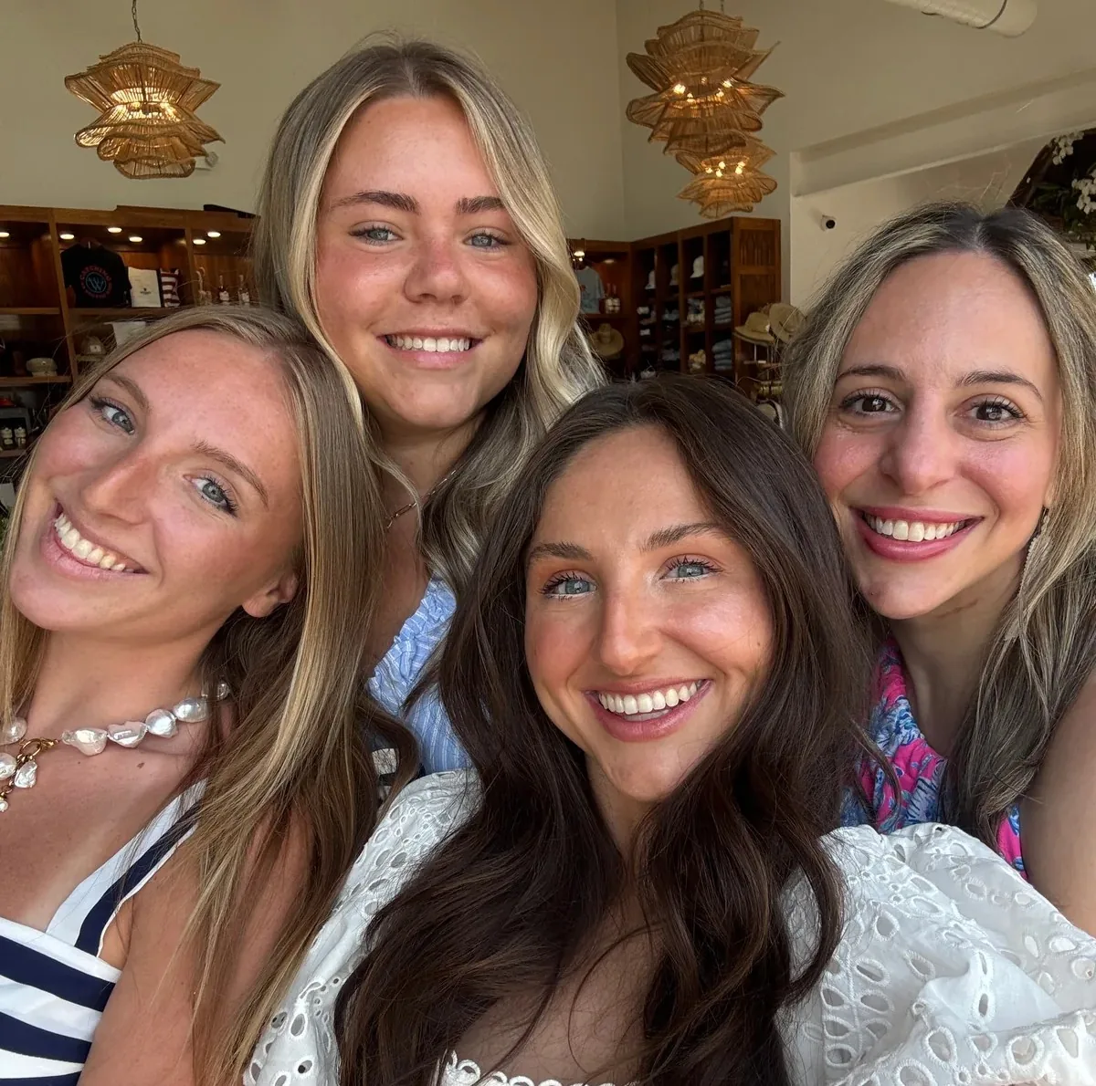 Four friends smiling together for a selfie